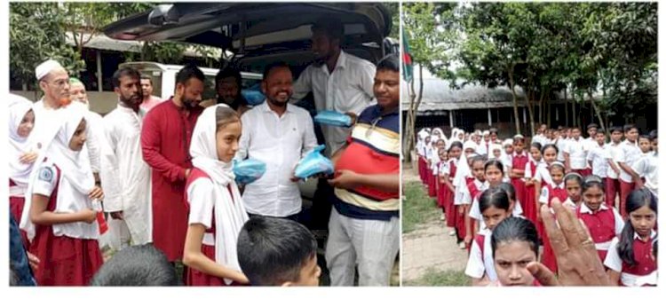 Distribution of tiffin and donation to students of Fakir Bazar Model Academy on behalf of expatriate Jahangir Alam