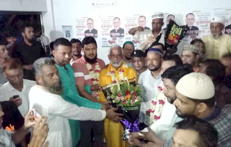Flower wishes and distribution of sweets to brave freedom fighter Akhlaq Haider as he was re-elected chairman in Burichong